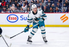 Celebrinis goal and askarovs save on penalty shot lead the sharks to 2 1 win over the penguins